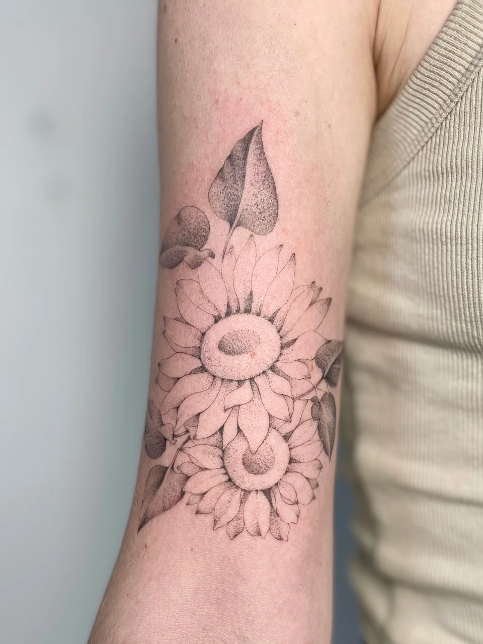 floral fine line tattoo on forearm